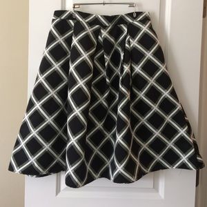 Express black and white plaid patterned skirt.