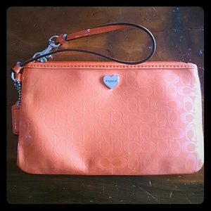 Coral coach wristlet