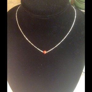 Short and simple necklace with an orange bread