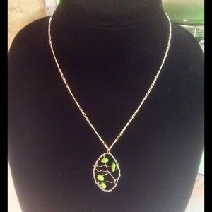 Elegant necklace with bead and wire pendant