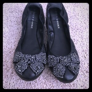 Black ballet flats with jeweled bow detail