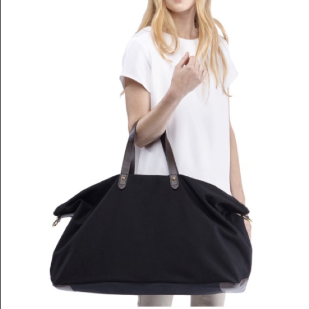 Cuyana black weekender with leather trim