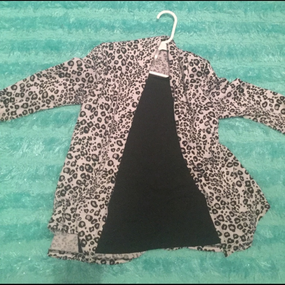 A Leopard shirt with a black tank under