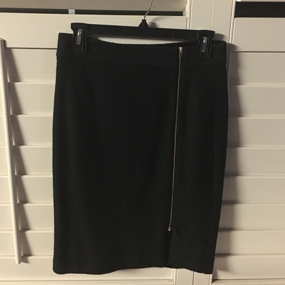 Black skirt with gold zipper.