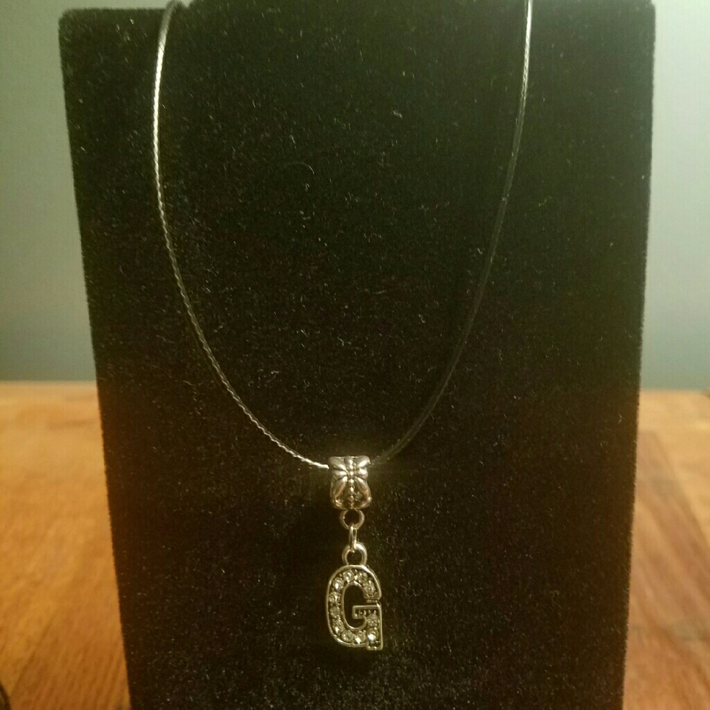 Brand new black cord necklace with "G" charm 16"