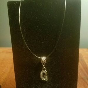 Brand new black cord necklace with "G" charm 16"