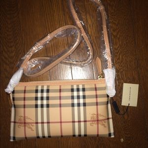 Never used Burberry mini clutch with strap.