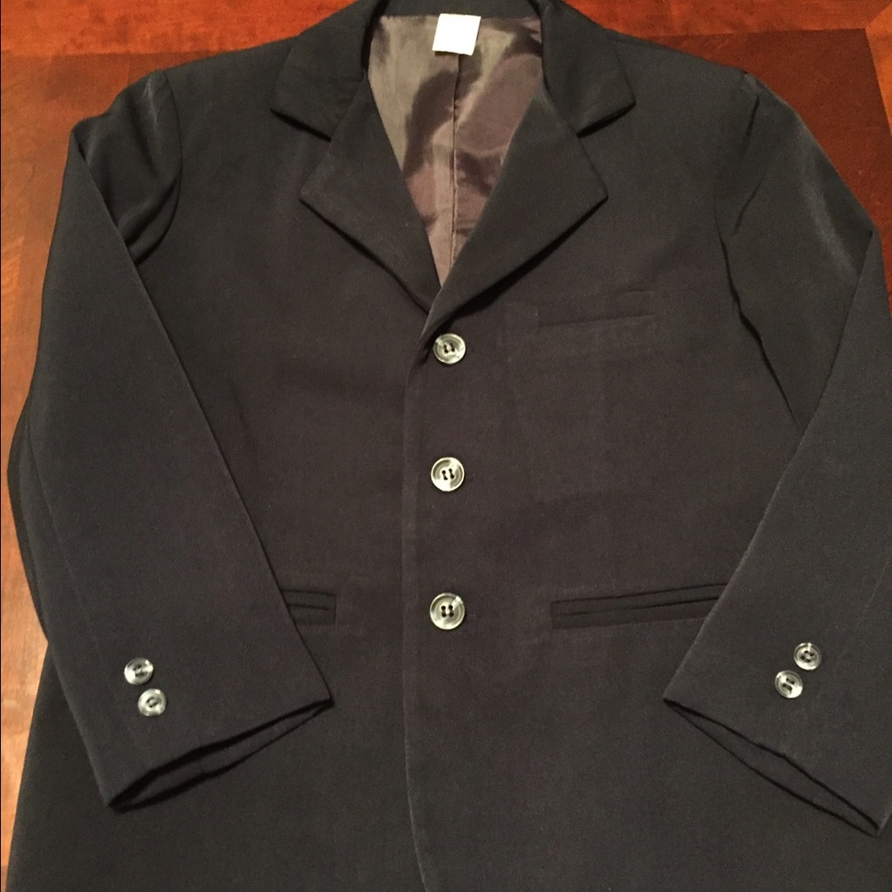 BOY'S NAVY SUIT. IN BRAND NEW CONDITION