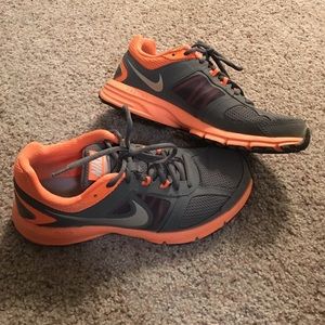 Grey and orange nikes