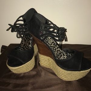 Black High wedge sandal.