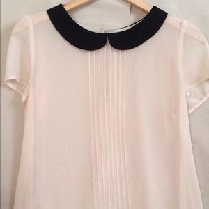 Feminine blouse with Peter Pan collar