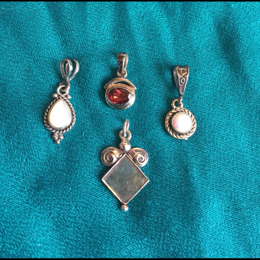 Multiple silver pendants...Garnet pendent sold