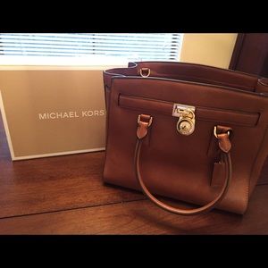 Micheal kors handbag in luggage.