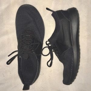 Blacked out NIKE running shoes