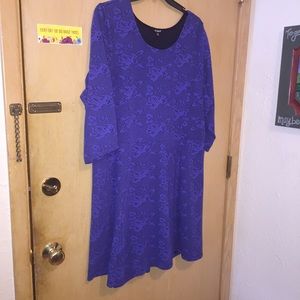 Blue knit dress with lace texture.