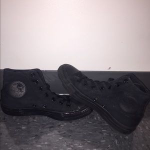 Converse Chuck Taylors all black high tops