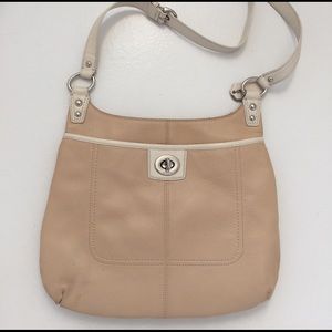 Coach, tan colored cross body bag