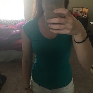 Cute turquoise shirt! Barely worn.