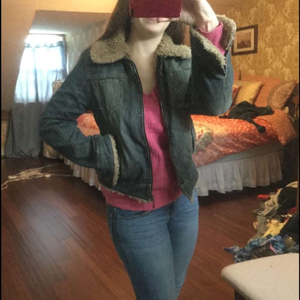 Denim jacket with fur like collar.
