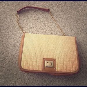 Brand new tan and straw clutch purse.