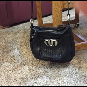 B. Makowsky black cross body bag.