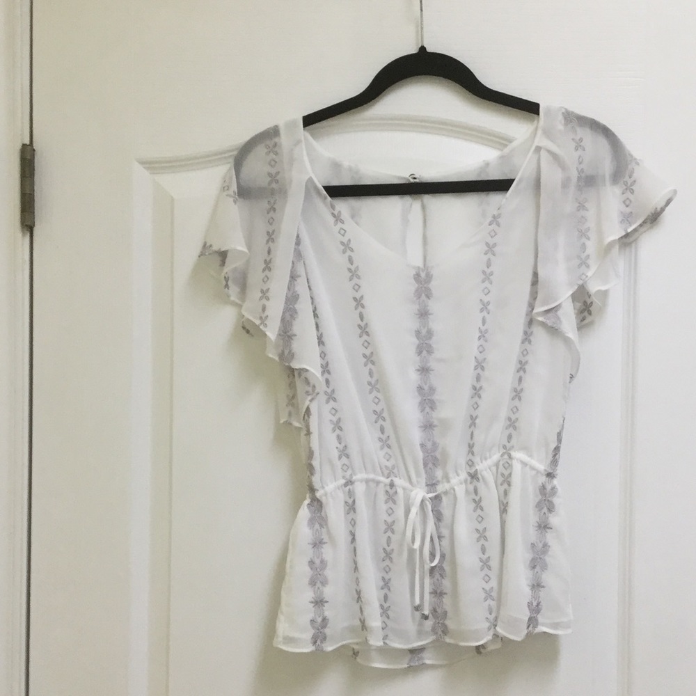 White, flutter sleeve blouse.