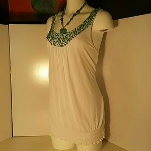 White blouse with turquoise.    (BT1)