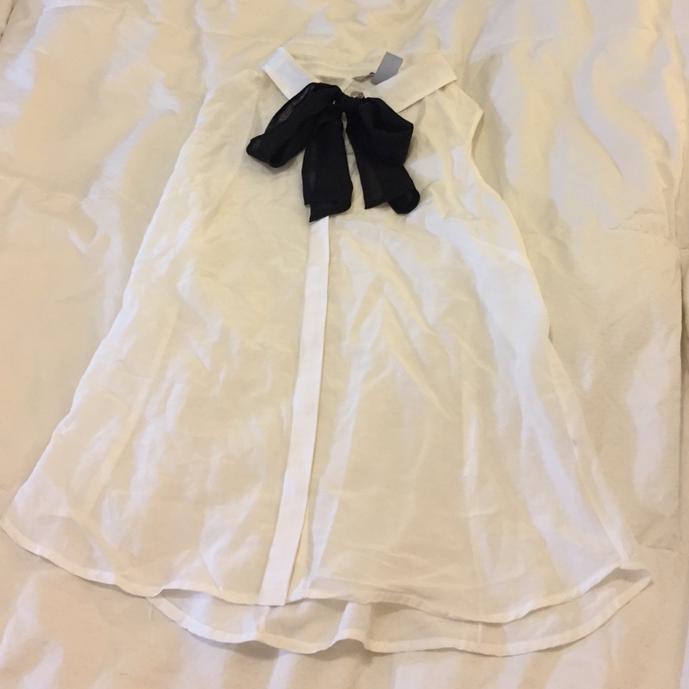 White blouse with black bow neck