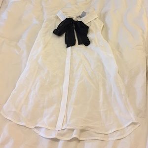 White blouse with black bow neck