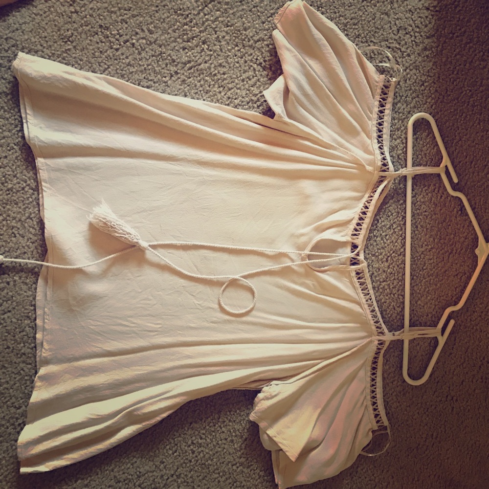 Off the shoulder light peach shirt