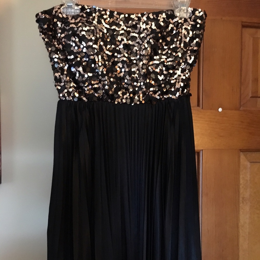 Black and gold sequined cocktail dress.
