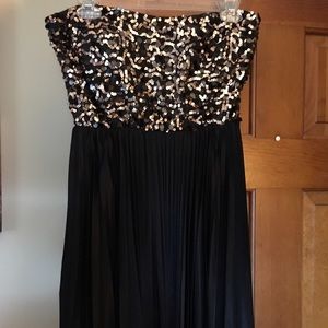 Black and gold sequined cocktail dress.