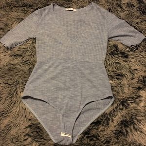 Women's blue bodysuit