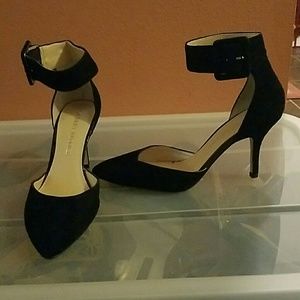 Black pumps with ankle strap
