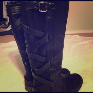 Black riding boots with strap up back design