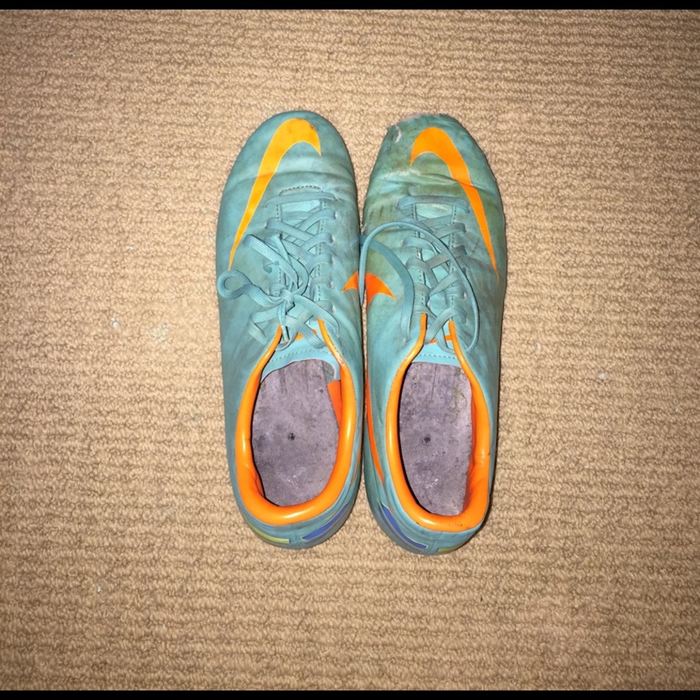 Blue and orange Nike cleats