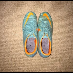 Blue and orange Nike cleats