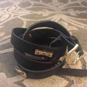 Gold bow accented belts