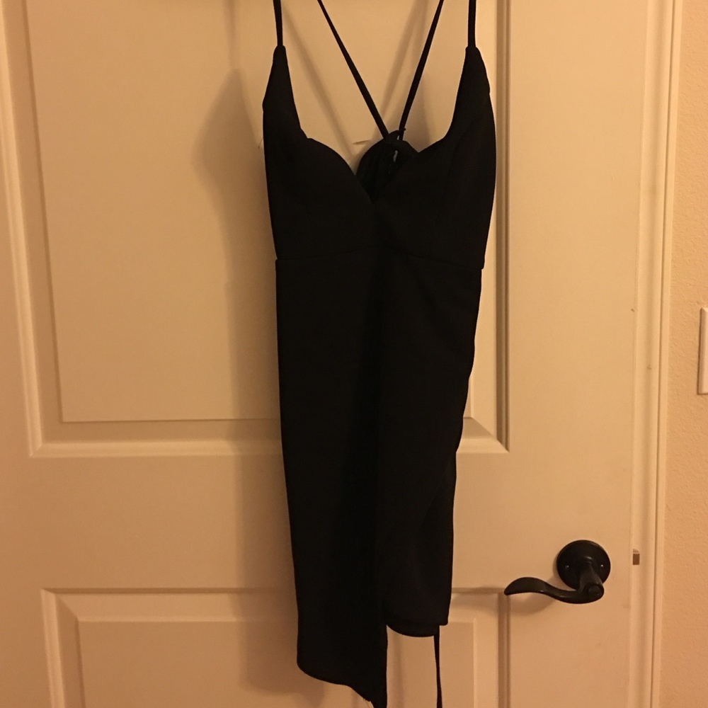 Very cute little black tie up dress.