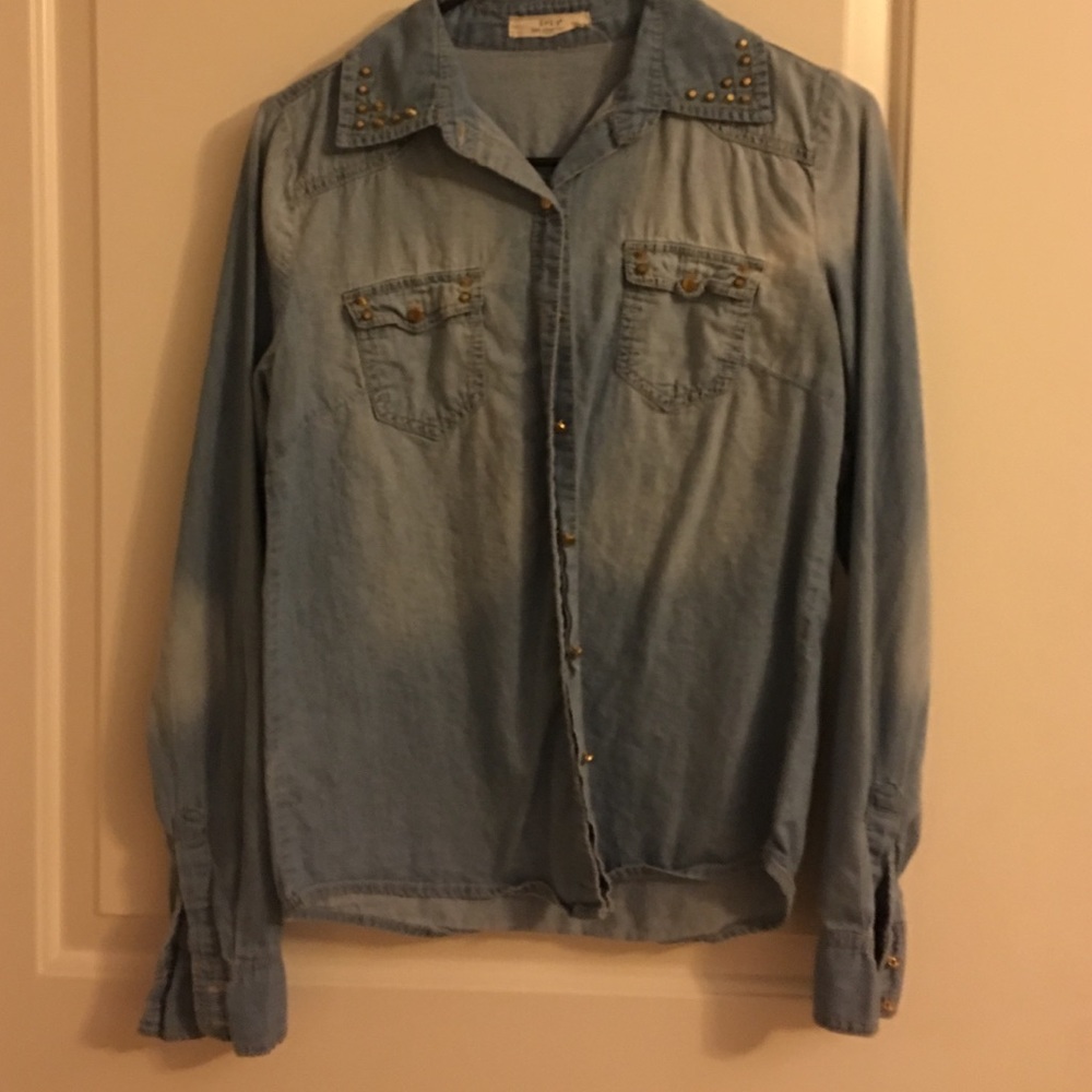 Jean top with gold studs.