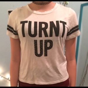 A white tee shirt that says Turnt Up