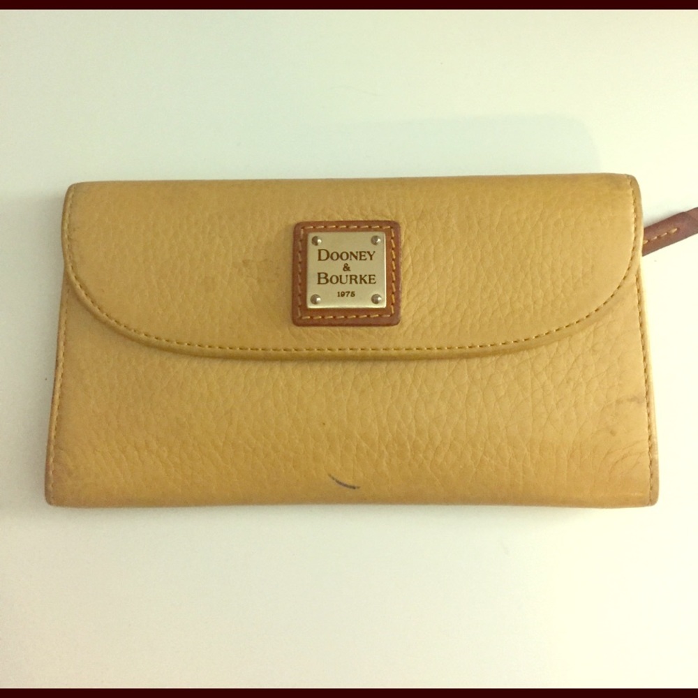 Dooney and Bourke wallet. Yellow and tan