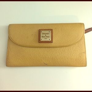 Dooney and Bourke wallet. Yellow and tan