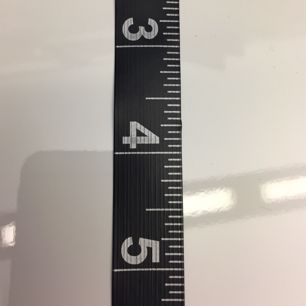 Beautiful black tape measure with silver numbers