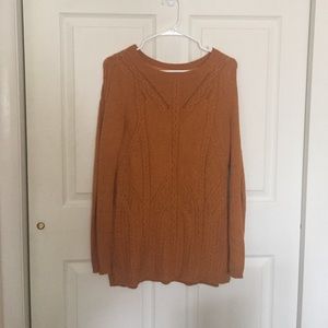 Long, mustard sweater