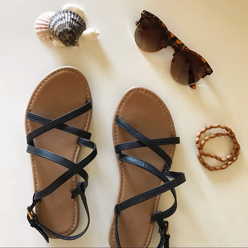 black faux leather cross sandals