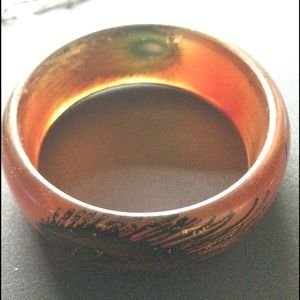 Metallic-y bronze resin bangle w peacock feathers