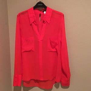 Red sheer blouse. Longer in back.