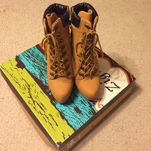 Tan high heeled boots