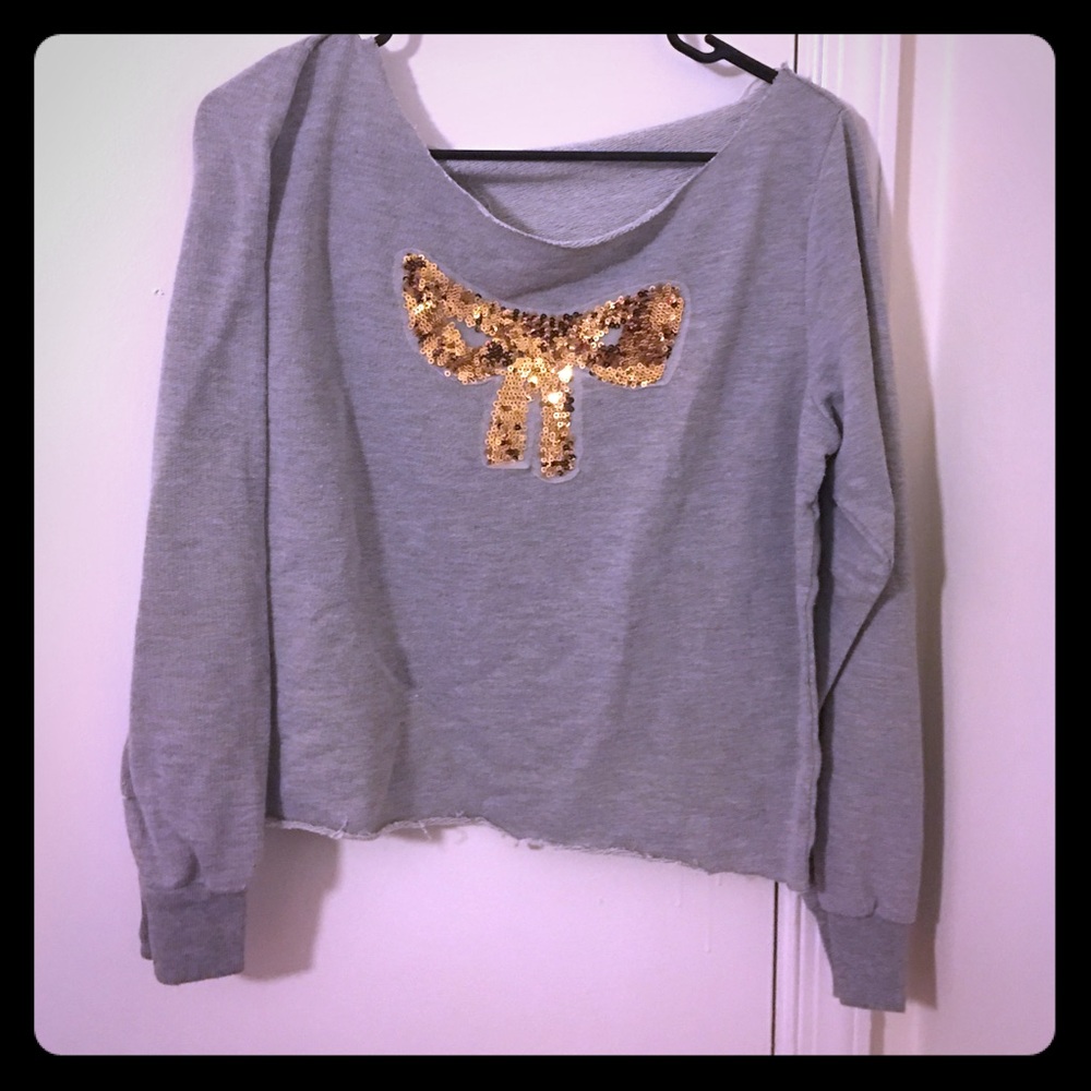 Gray sweater with gold sequin bow detailing